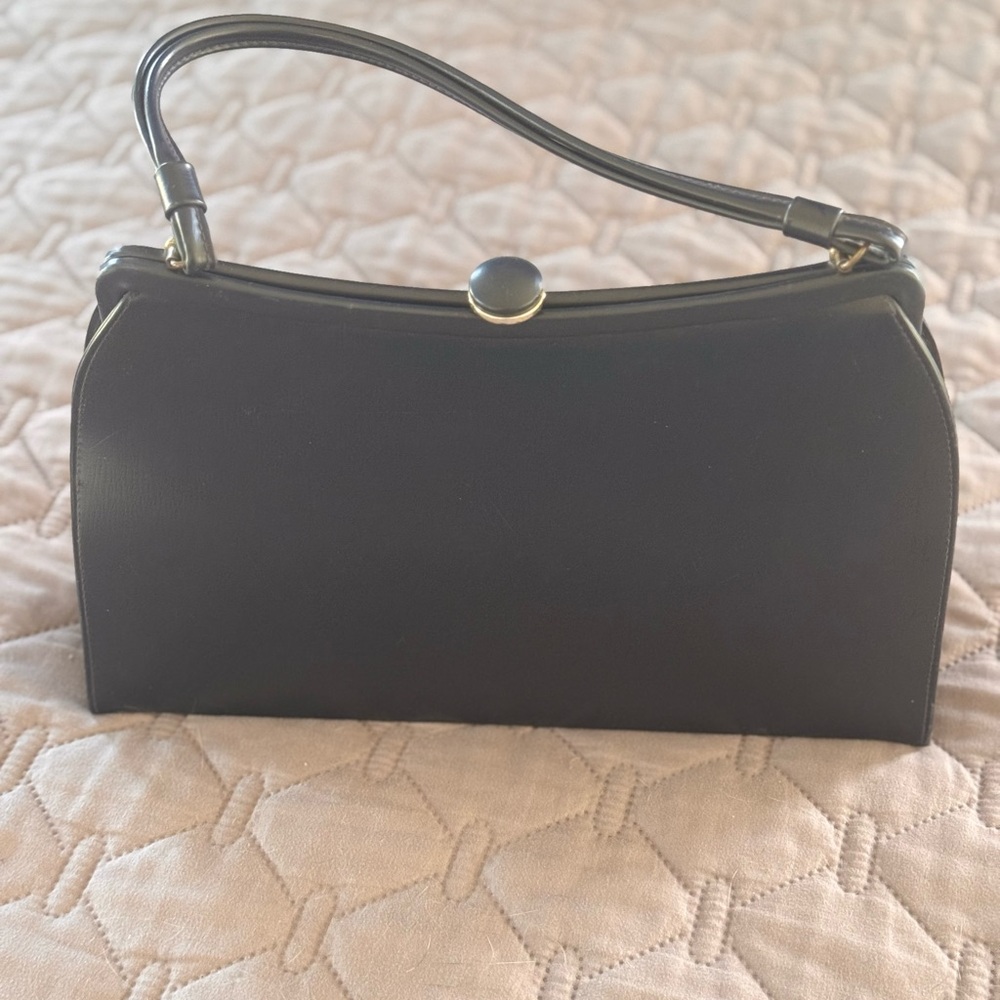 Black Clutch with Gold-Toned Clasp and Textured Finish